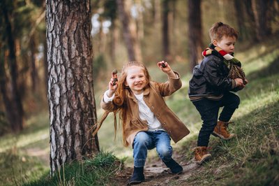 girl-with-her-little-brother-together-forest