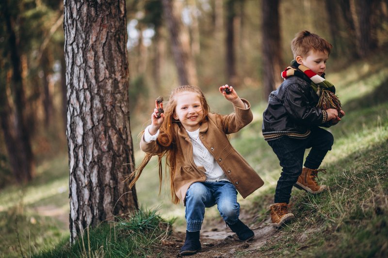 girl-with-her-little-brother-together-forest